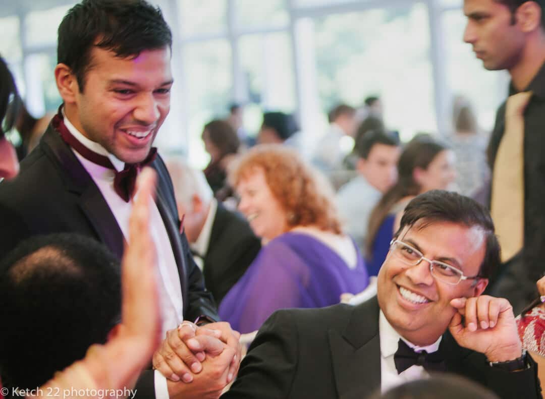 Groom greeting relatives at Hindu wedding