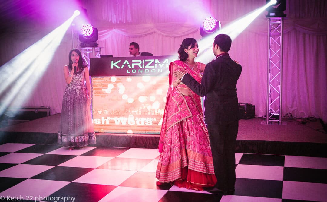Bride and groom at first dance at Indian wedding in London