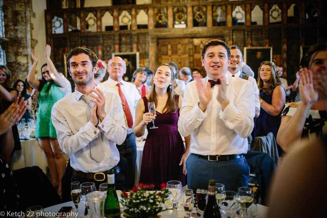 Wedding guest clapping at wedding speeches