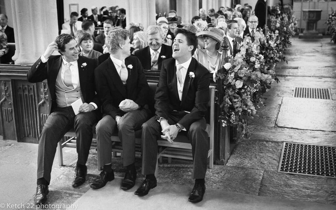 Groom and ushers laughing prior to wedding ceremony 
