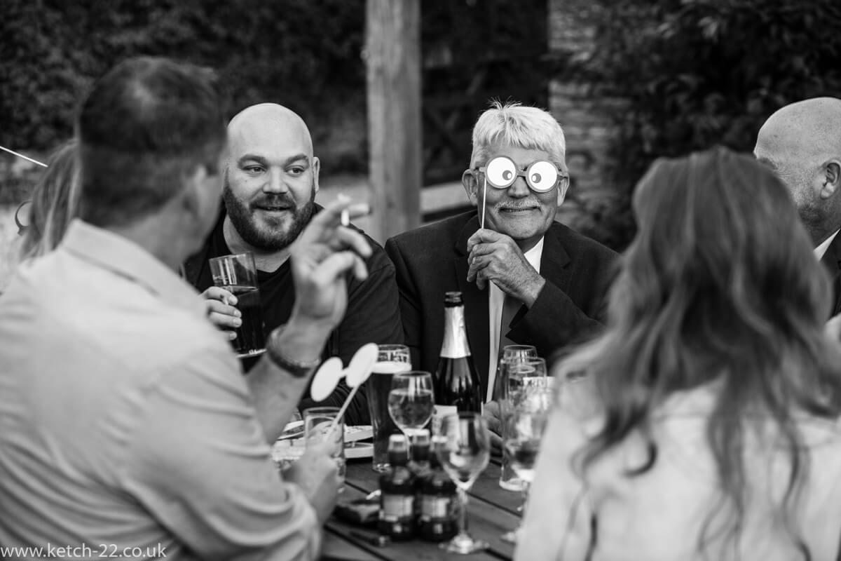 Wedding guest wearing comic eyes at the Great Tythe Barn