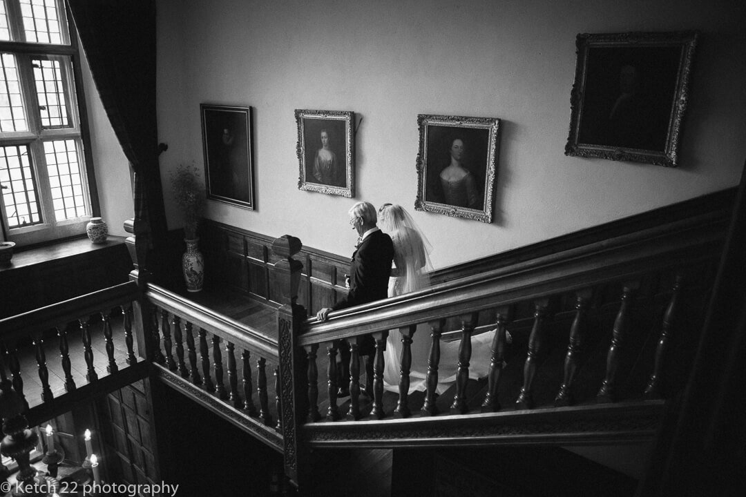 Father and bride descending stair case at Country House wedding