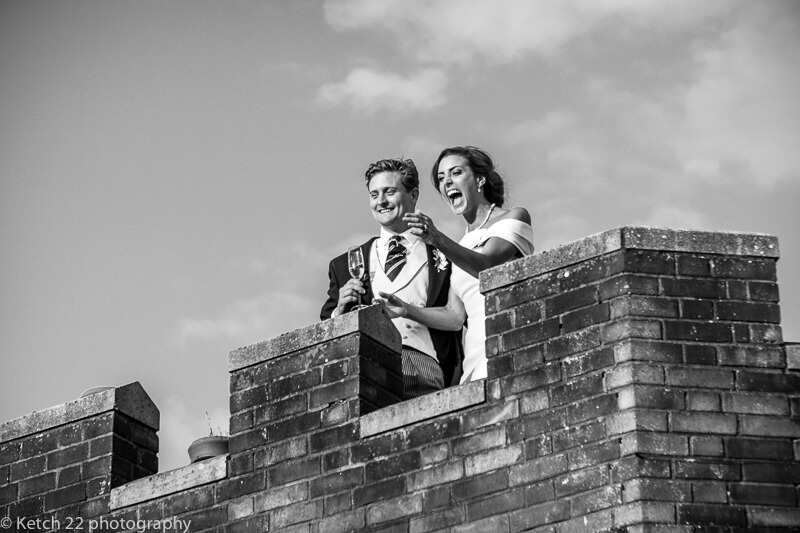 Bride and groom on roof top at Dorset Summer wedding