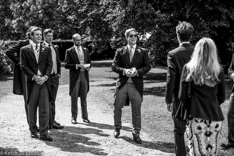 Ushers greeting guests at Dorset Summer wedding