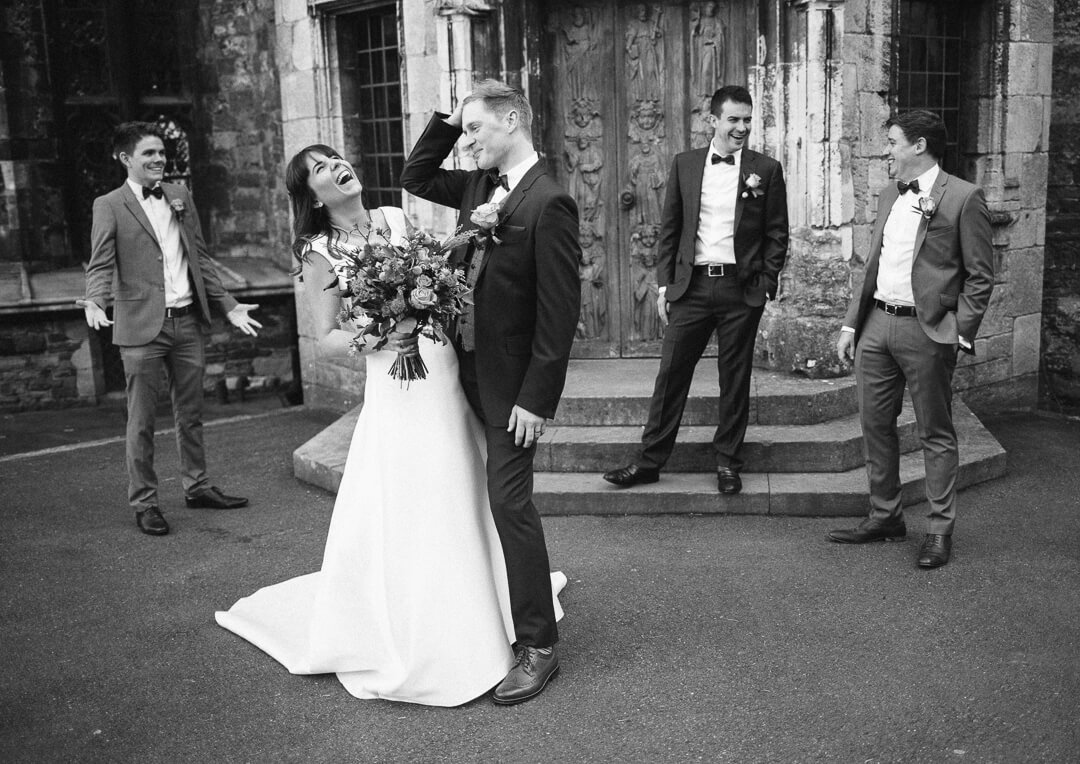 Quirky portrait of bride and groom at Berkeley castle wedding Gloucestershire