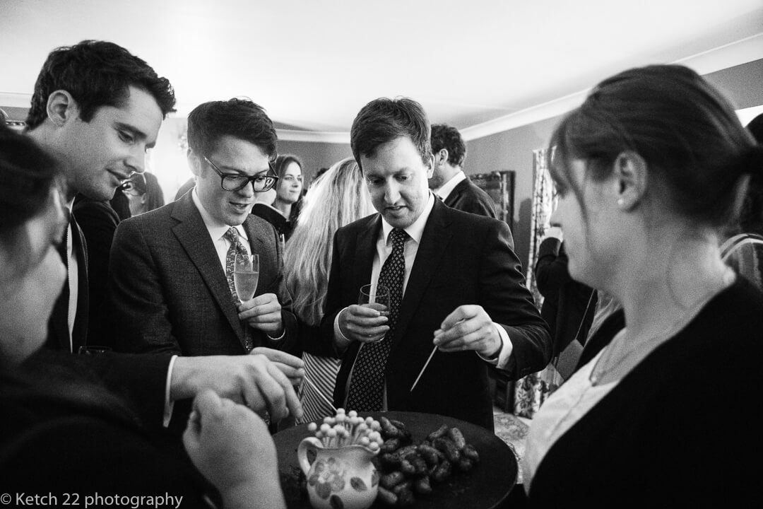 Wedding guests enjoying canapes at wedding in Oxfordshire