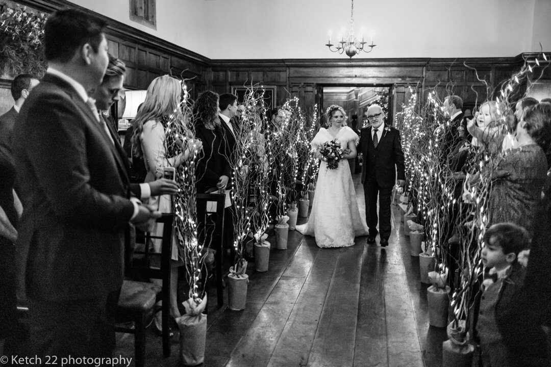 Bride walking down aisle at Christmas wedding at North Cadbury Court