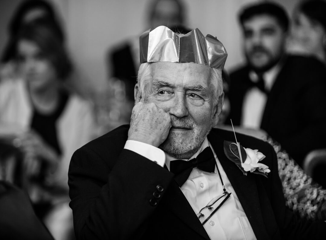Grandad listening to the speeches at a Winter Welsh Wedding
