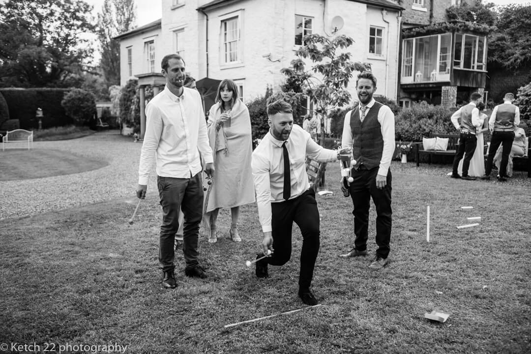 Guests play wedding lawn games