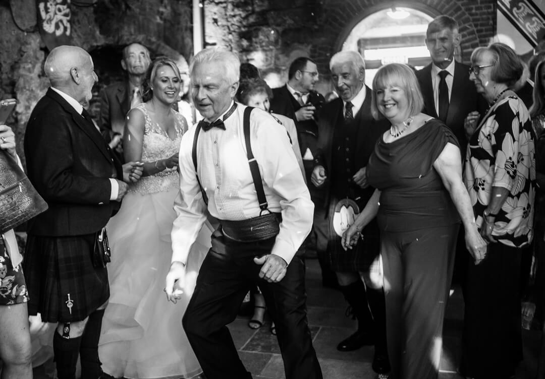 Father of bride dancing at wedding reception