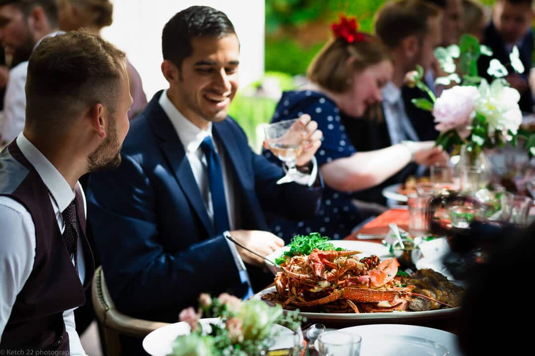 Wedding guests enjoy lobster meal