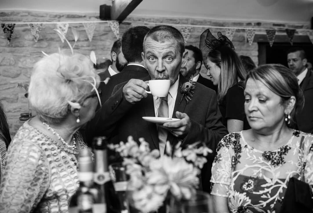 Wedding guest enjoying a cup of tea
