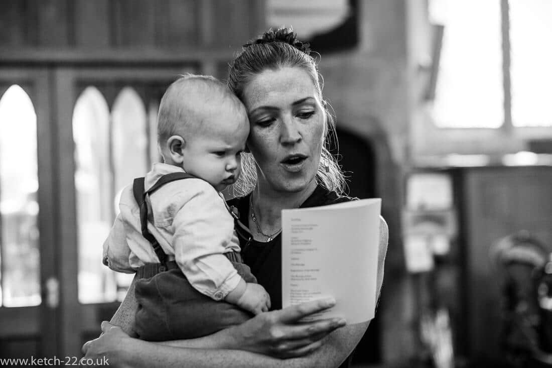 Mother and baby singing at wedding