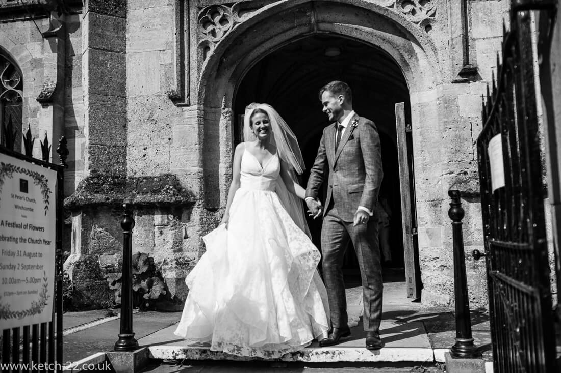 Bride and groom outside church after wedding ceremony