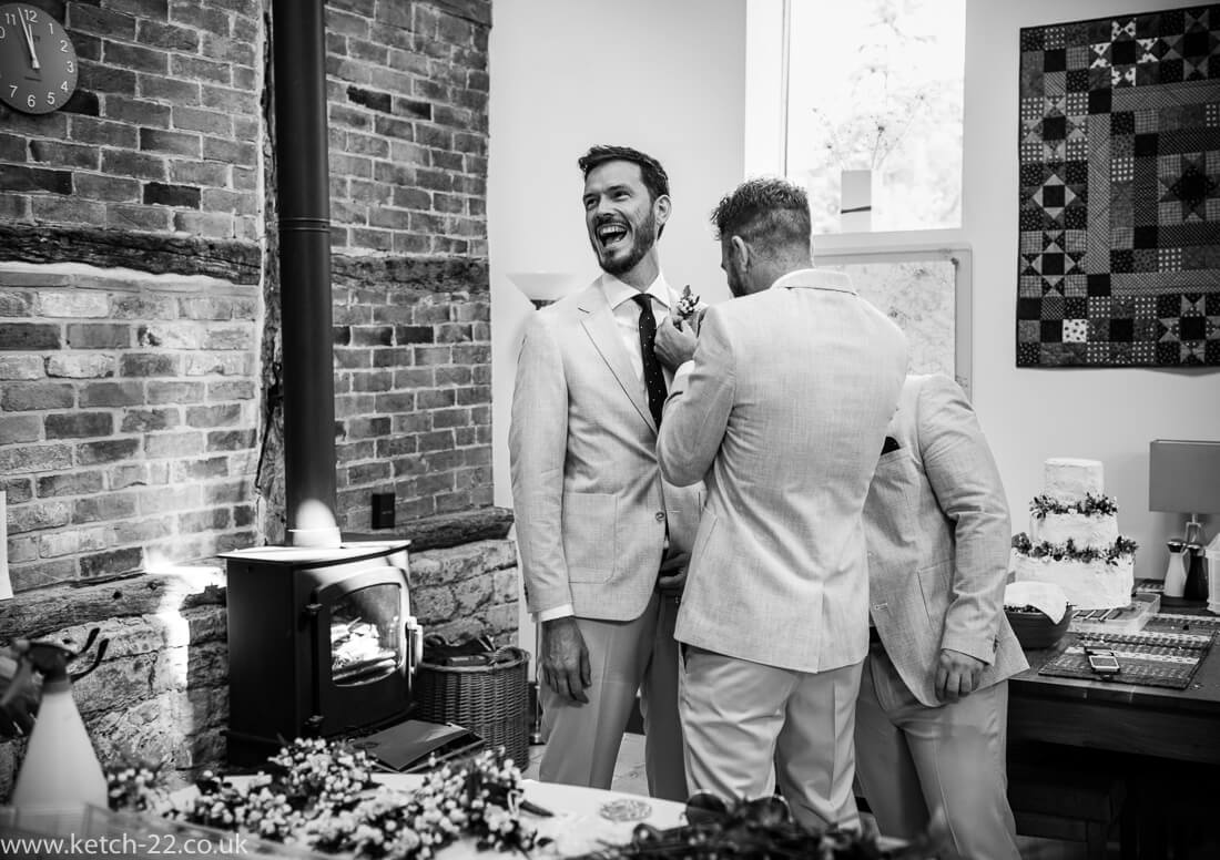 Laughing best man for Winchcombe wedding photography post