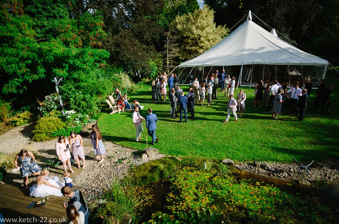 View of wedding marquee and guests