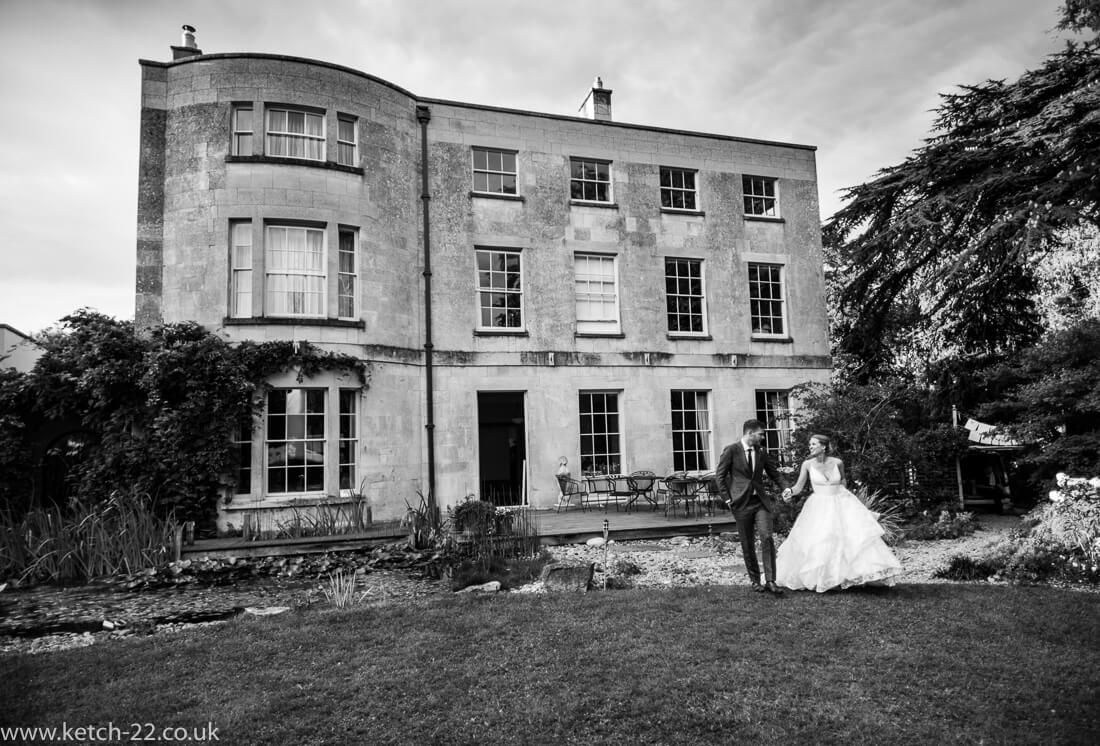 Natural wedding photo of bride and groom in black and white