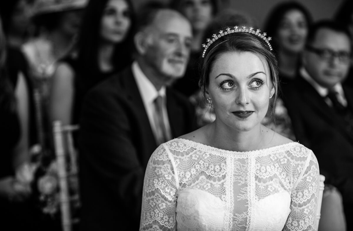 Bride looking at registrars during summer wedding ceremony