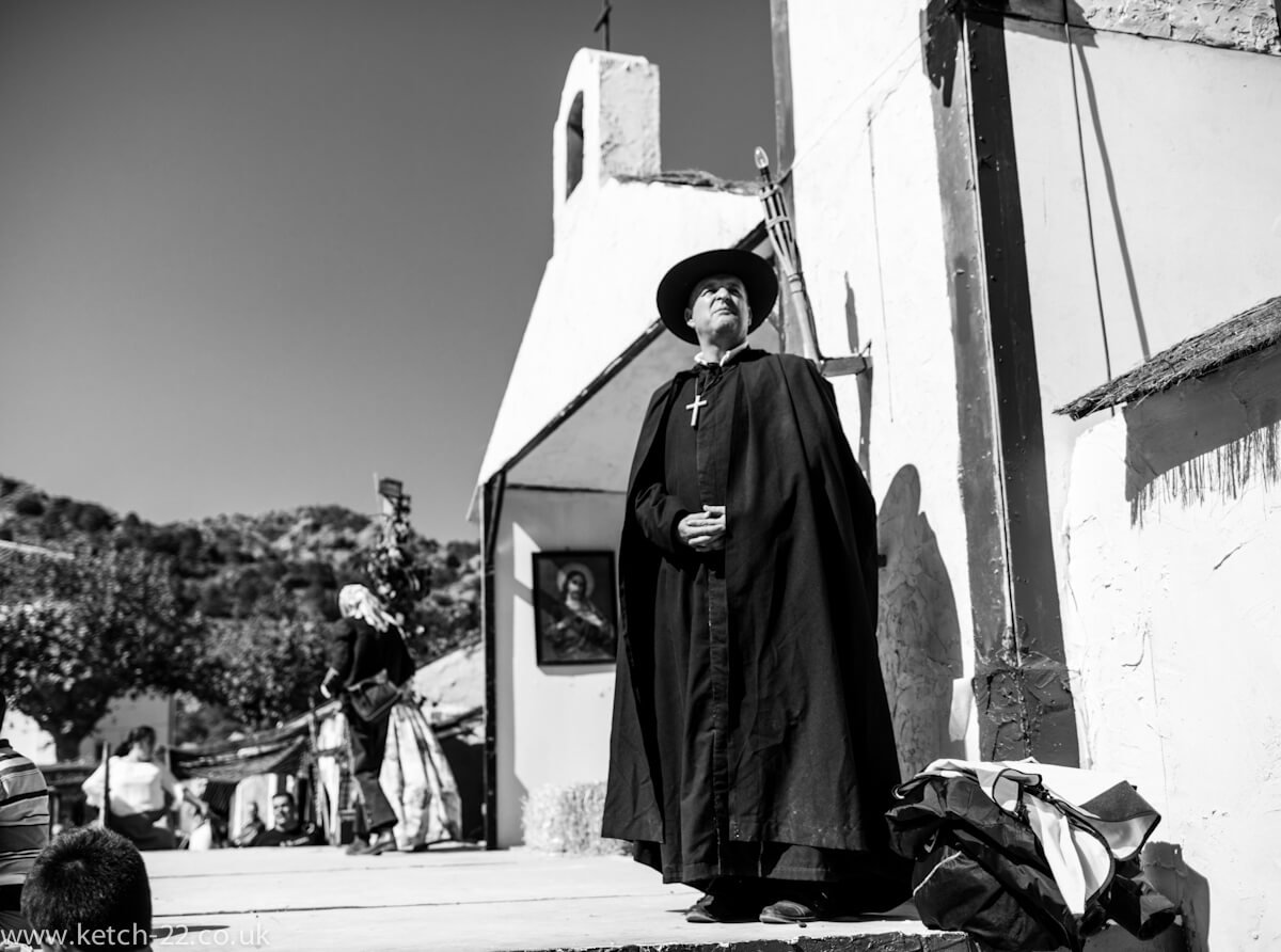 Man dressed as Priest in black and white at Grazalema fiesta