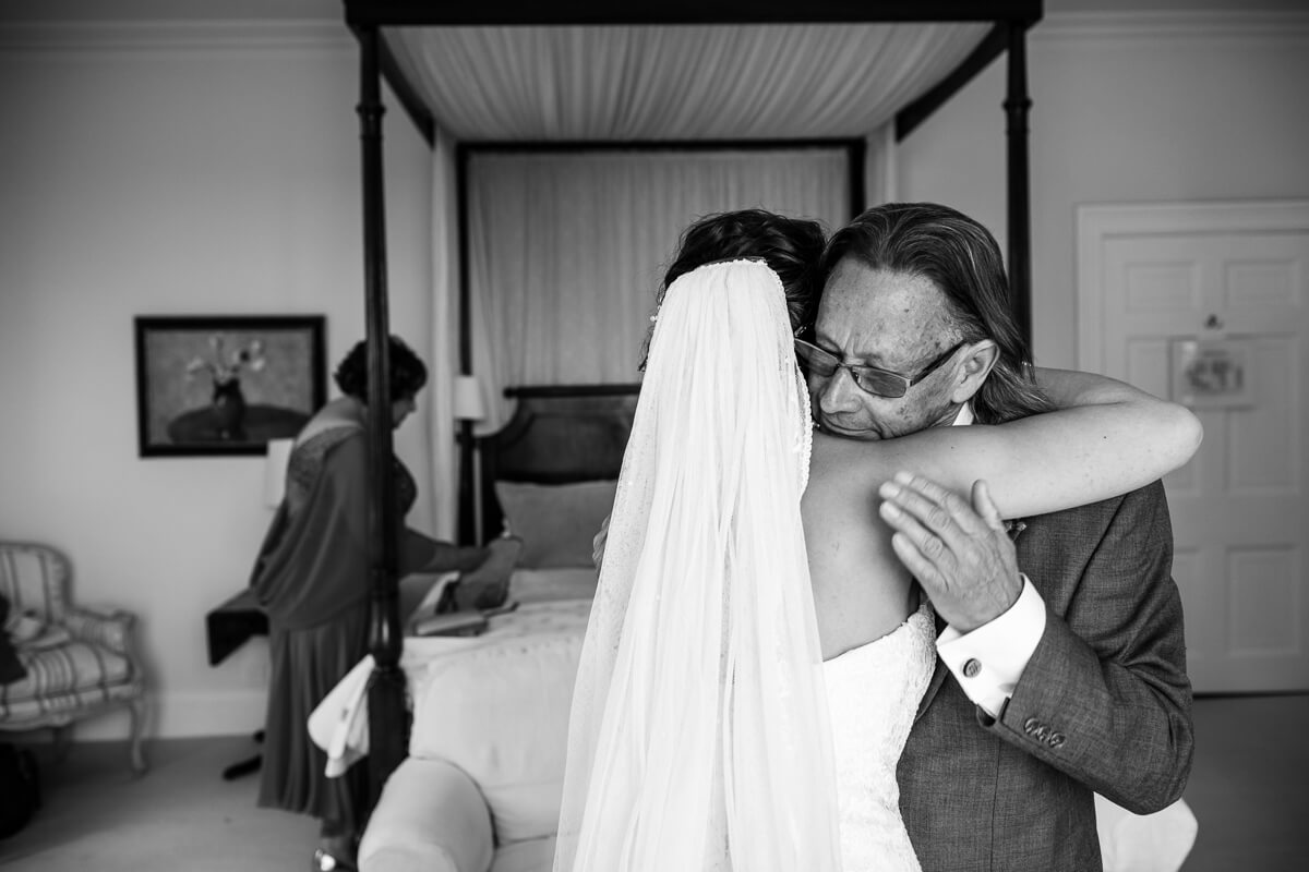Father of bride gives his daughter a emotional hug 
