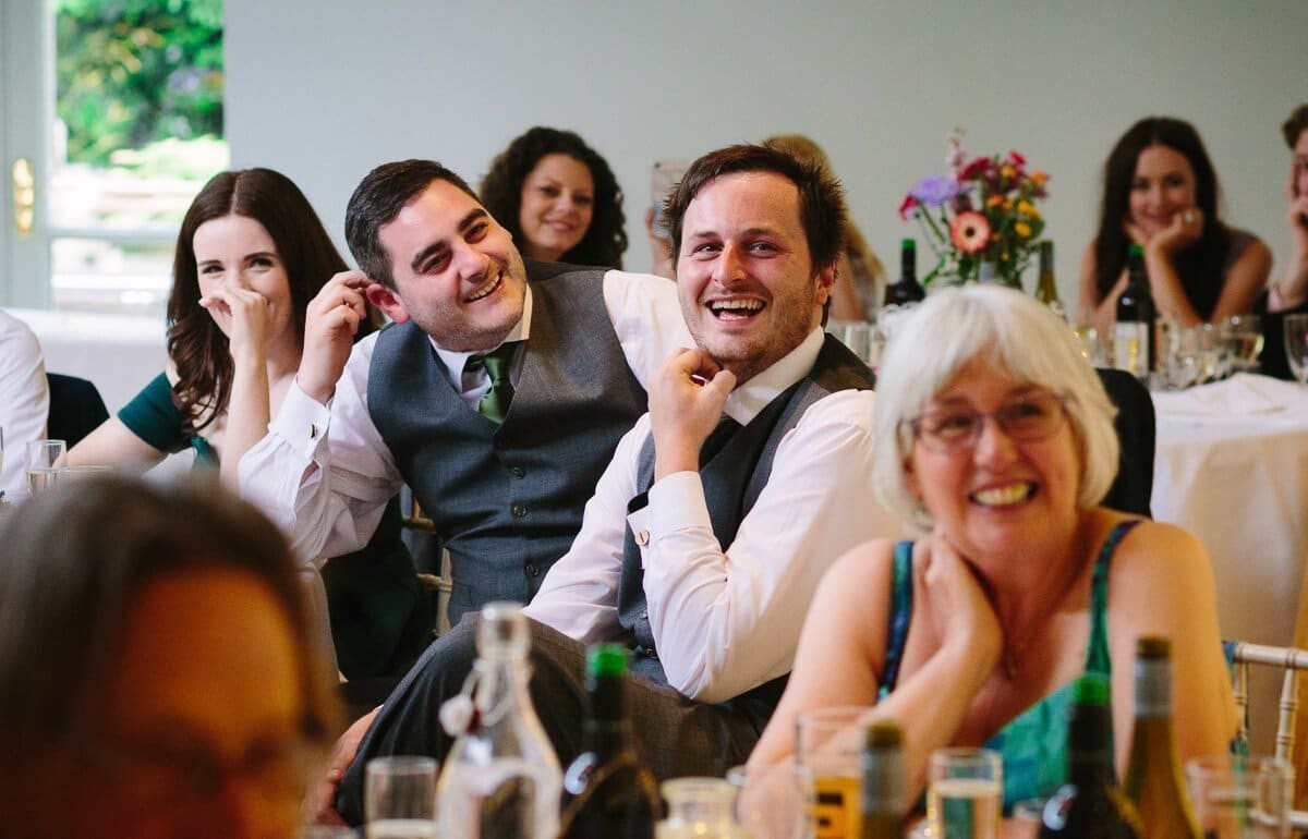 Wedding guests laughing at speeches