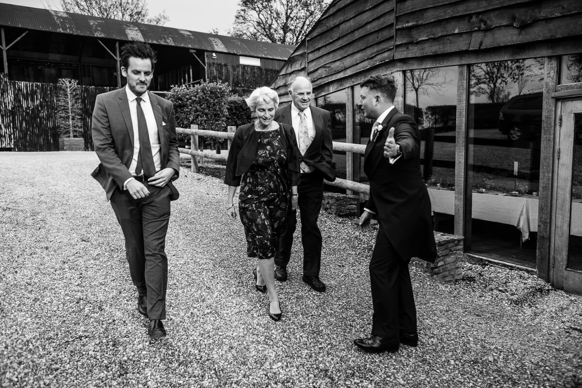 Wedding guests arriving at Cripps Barn