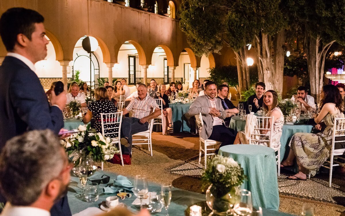 Guests listening to speech at Wedding in the Castillo de Santa Catalina