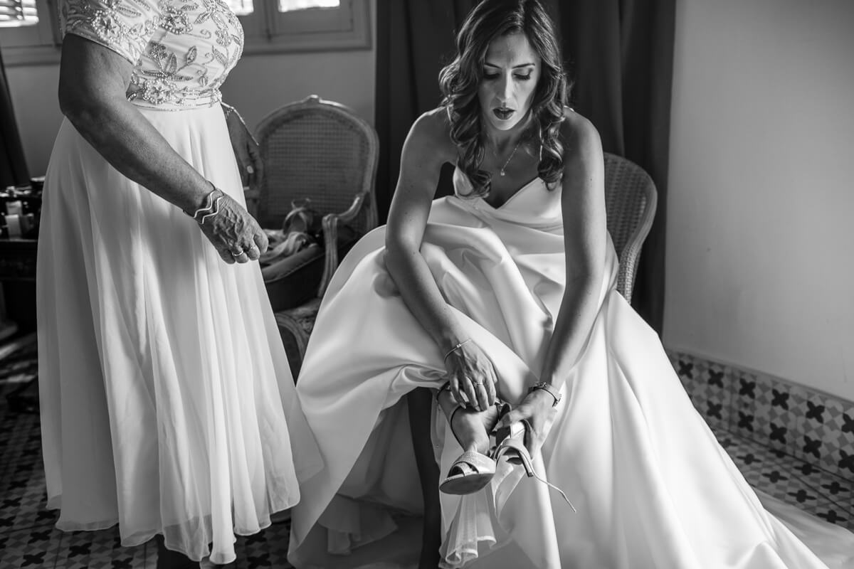 Bride putting on her shoes at Wedding in Malaga Spain