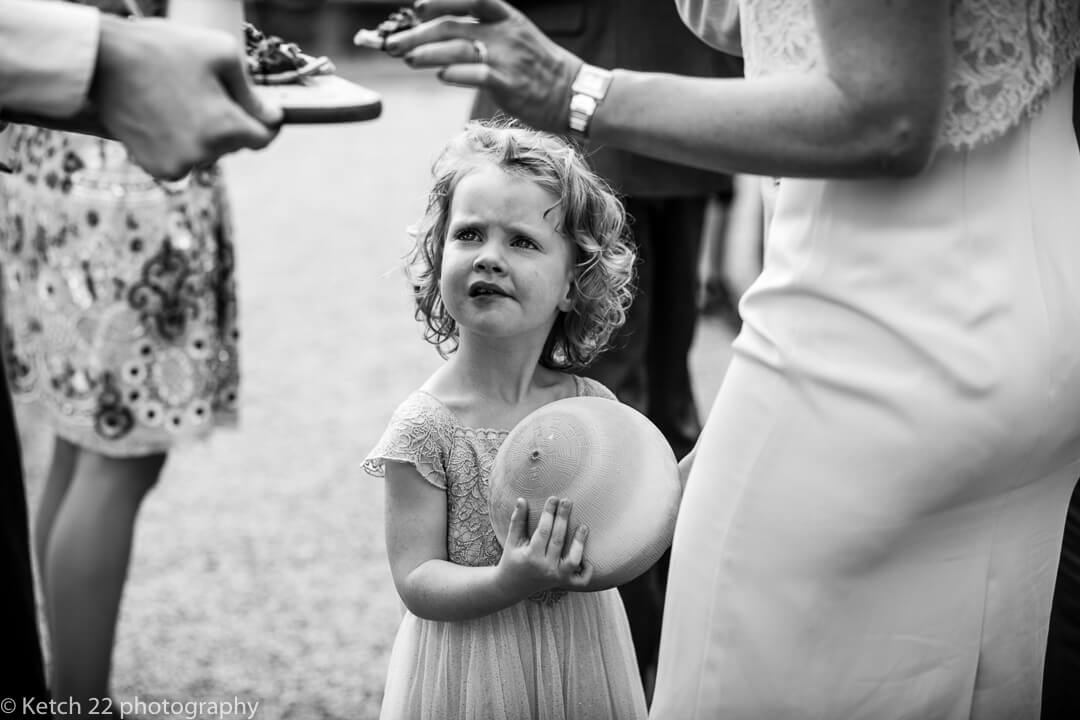 Flower girl looking bemused at Whitney Court wedding