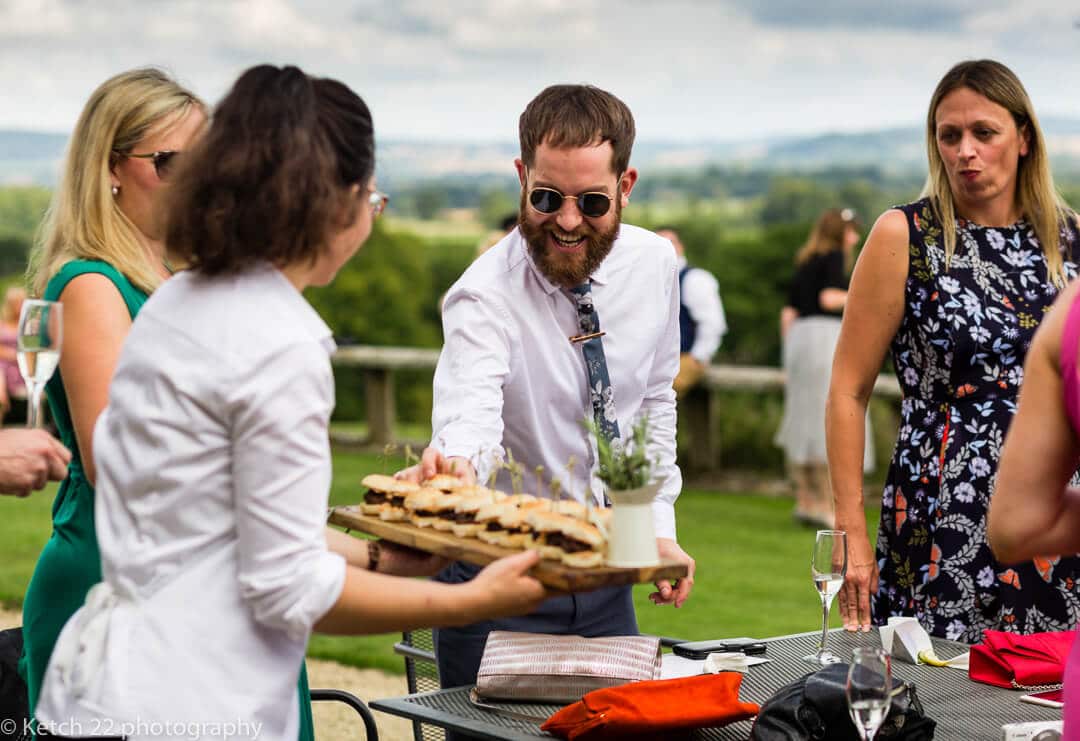 Wedding guest enjoying canapes at Whitney Court