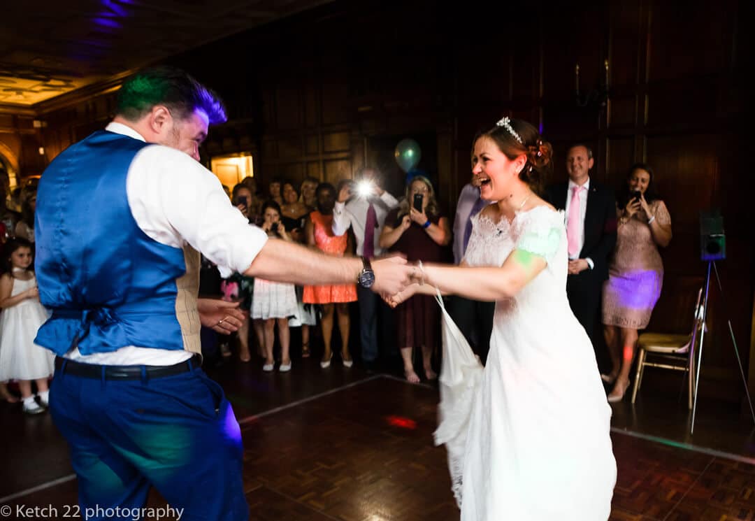 Bride laughing at first dance at wedding reception