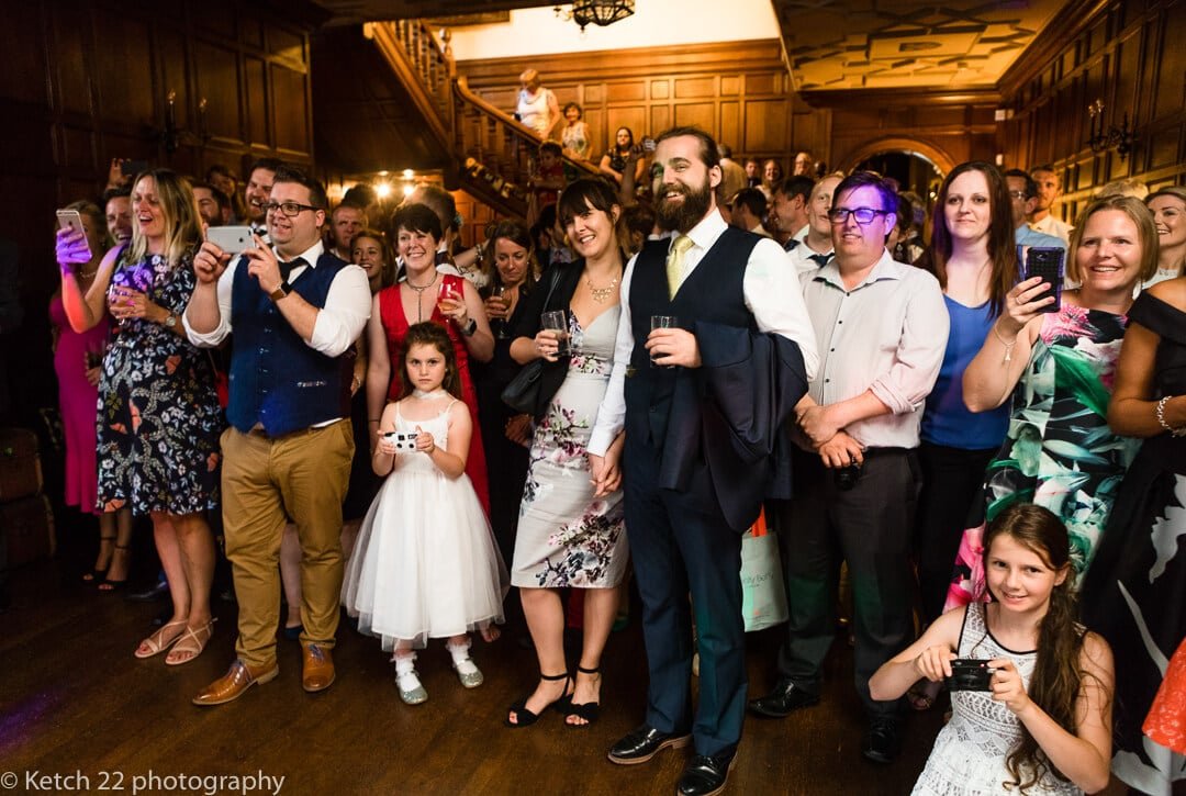 Wedding guests watching bride and groom dancing at Whitney Court