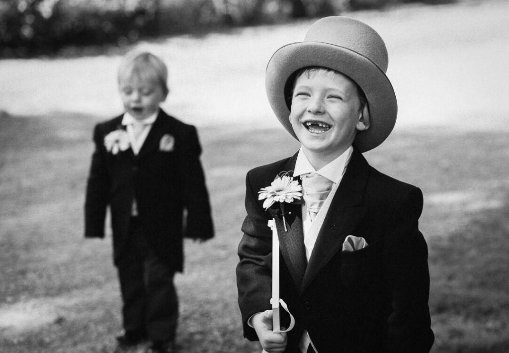 Page boy wearing top hat and tails at Cheltenham wedding