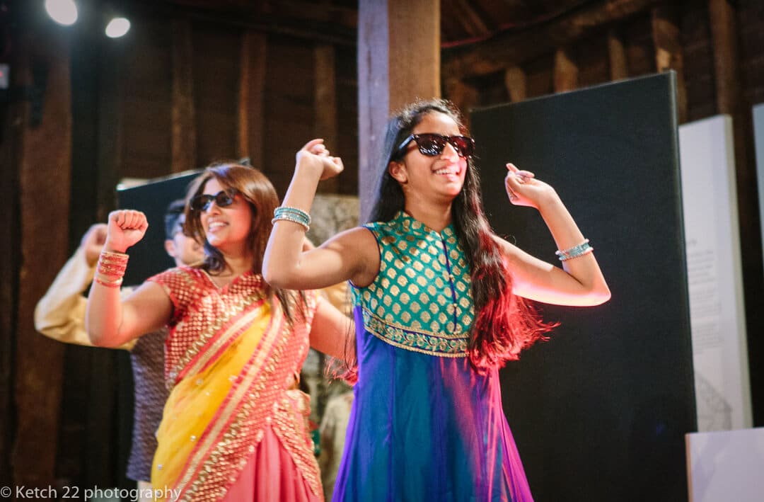 Dancers wearing sunglasses dancing at Indian henna night