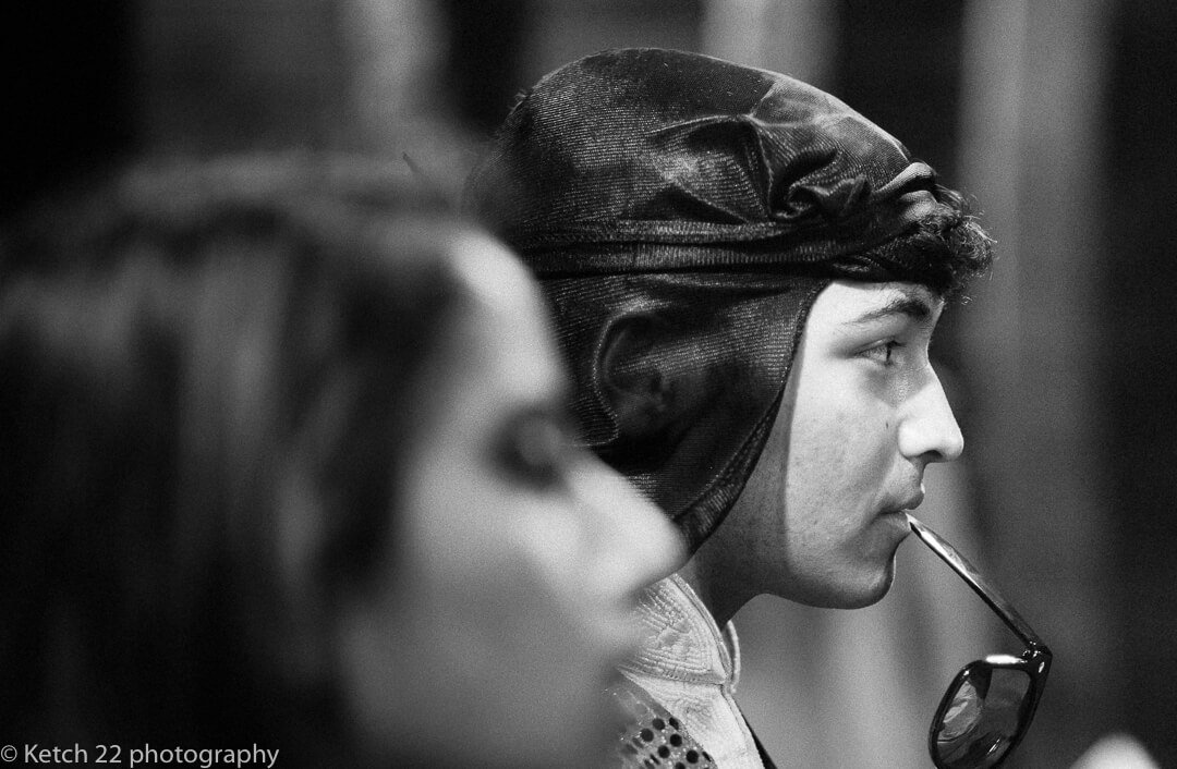 Performer wearing black head gear at Indian Henna night