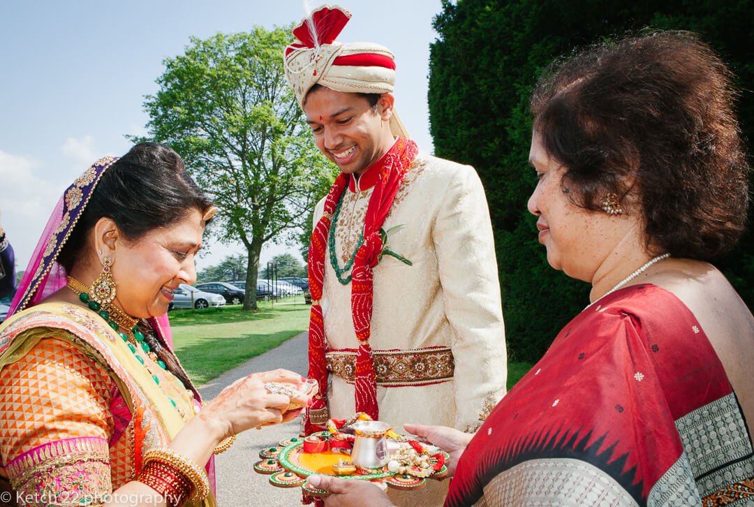 Groom attending Indian wedding customs 