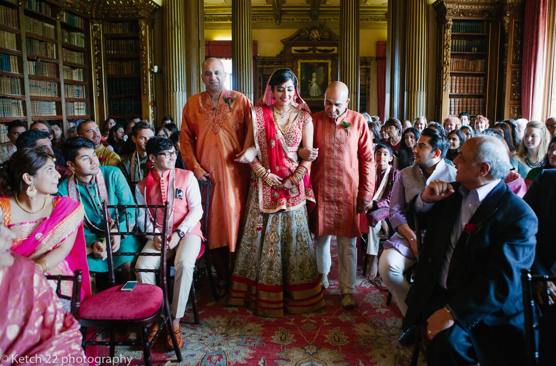 Bride enters hindu wedding ceremony at Highclere Castle