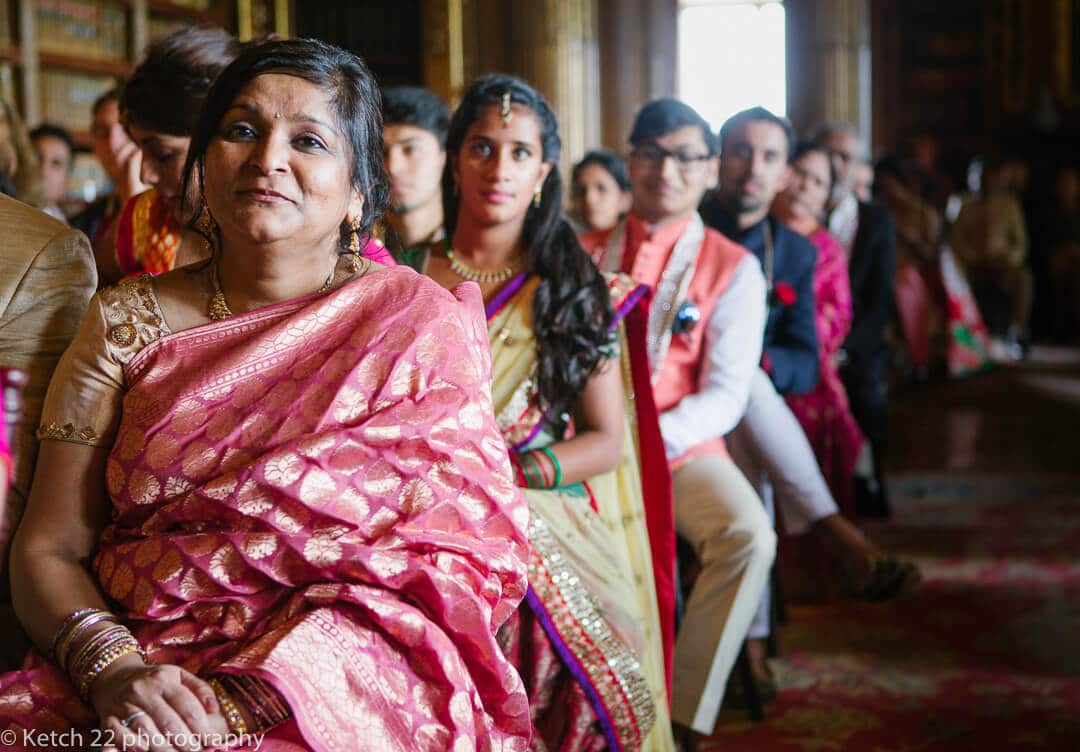 Wedding guests watching Indian ceremony