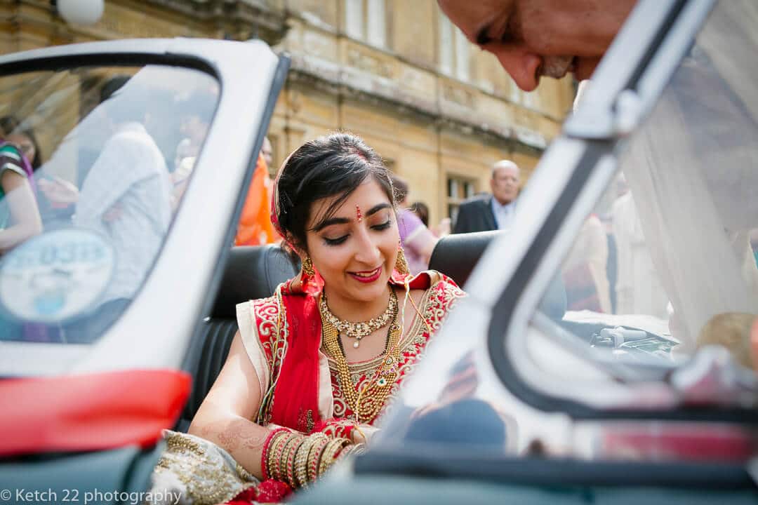 Hindu bride in wedding car