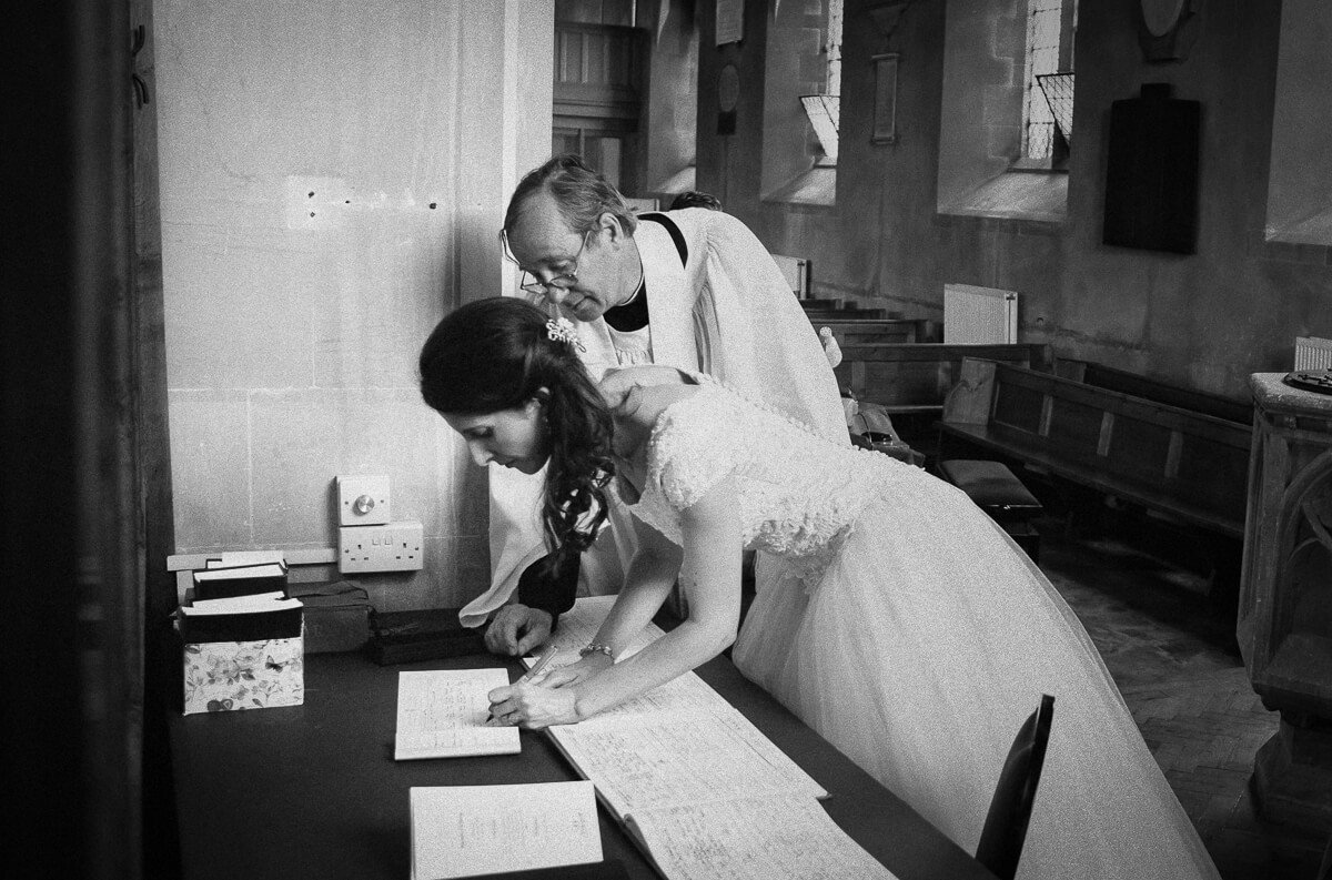 Bride signing the book