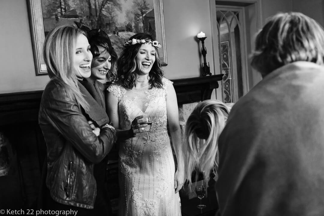 Bride chatting to wedding guests at reception