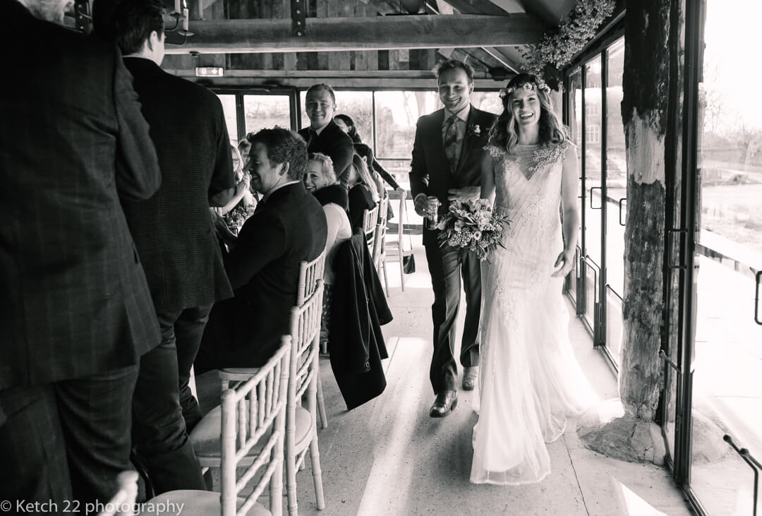 Bride and groom enter dinning room at wedding