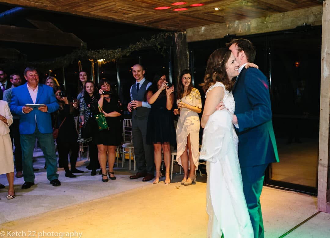 Bride and groom enjoying first dance at wedding reception