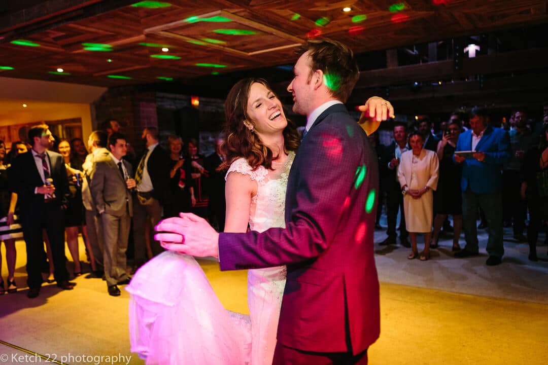 Bride and groom dancing at barn wedding reception