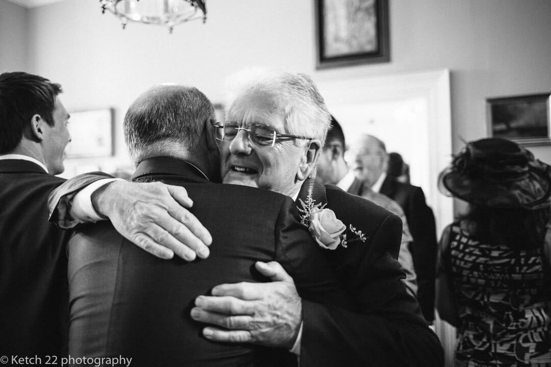 Wedding guests hugging at Herefordshire wedding