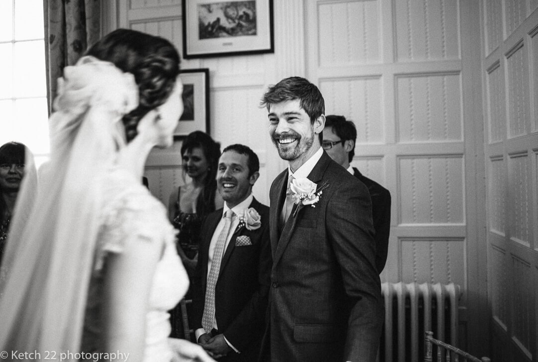 Groom looking at bride for the first time at relaxed wedding ceremony in Herefordshire