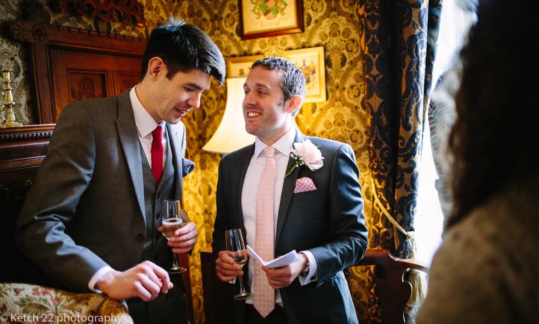 Candid wedding photo of guests chatting