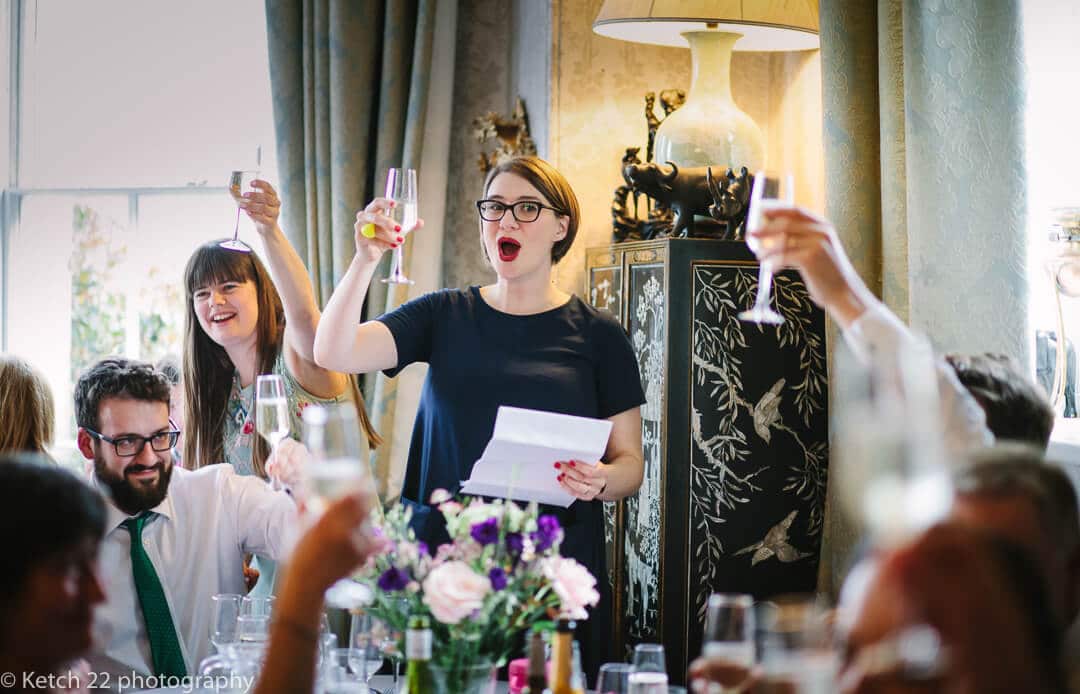 Wedding guests toasting at speeches