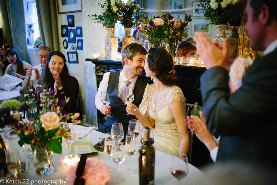 Bride and groom share an intimate moment at wedding speeches