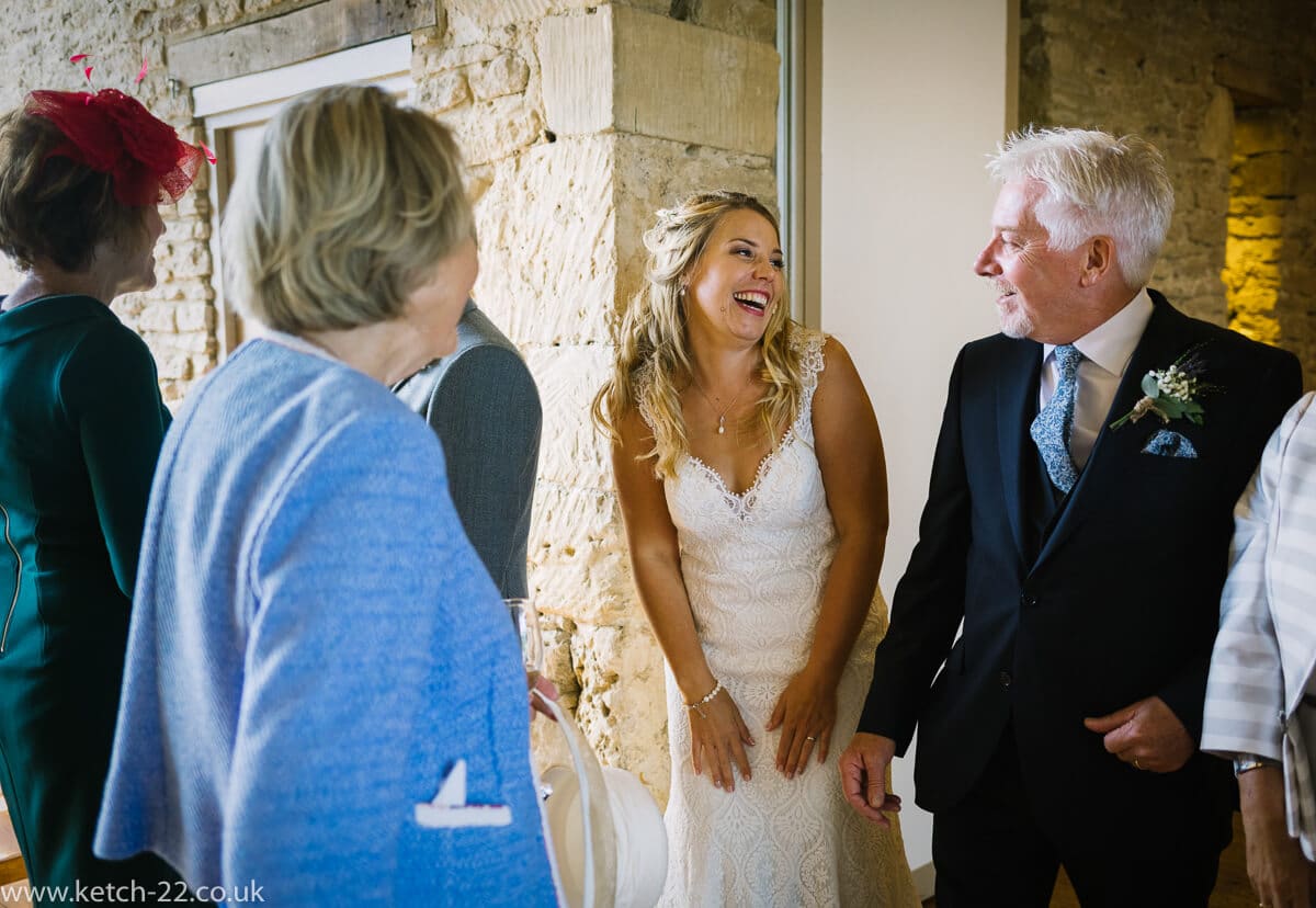 Bride laughing with her father